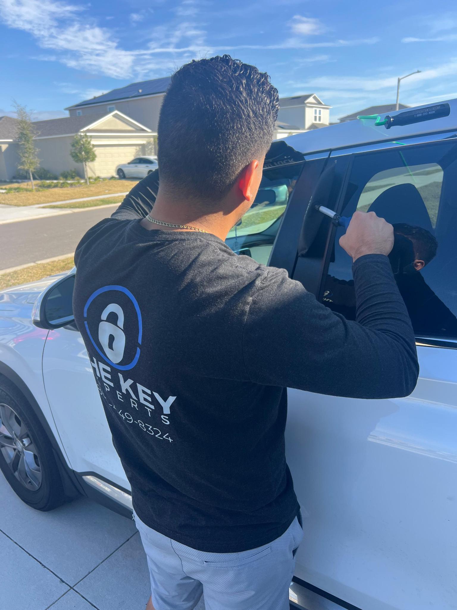 Mobile locksmith at a vehicle in Poinciana, Florida
